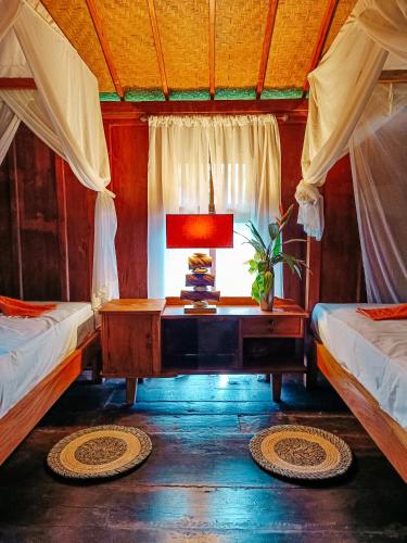Voodi või voodid majutusasutuse Alaya Ecolodge toas