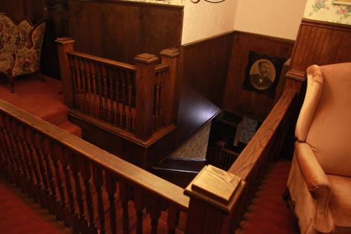 an overhead view of a wooden staircase with a chair at The Winter Inn in Greenville