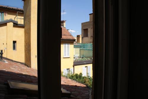 a view from a window looking out at buildings at Tourist House Bologna - Self check-in in Bologna