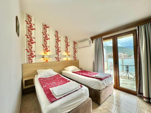 Postel nebo postele na pokoji v ubytování Hotel Grbalj