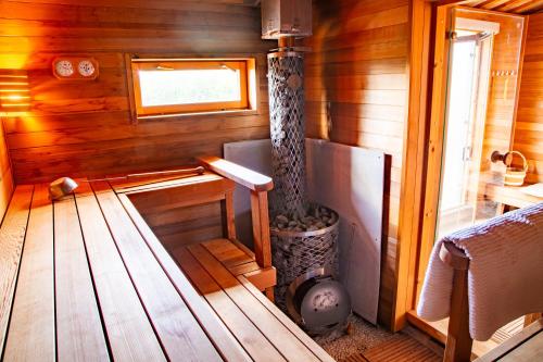 a room with a woodburning stove in a cabin at Casali Marchigiani - Ville vacanza private con piscina in Ostra