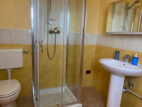 a bathroom with a shower and a toilet and a sink at Le tre terrazze - Gallipoli in Gallipoli