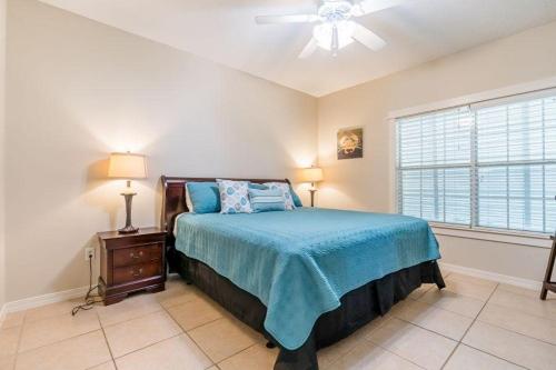 En eller flere senge i et værelse på Orange Beach Villas - Allure