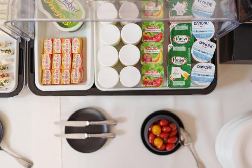 a refrigerator filled with lots of food and eggs at Logis Hôtel Restaurant Ritter'Hoft in Morsbronn-les-Bains