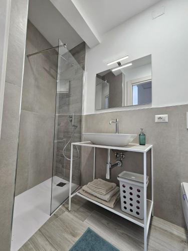 a bathroom with a sink and a shower at Casa Cesarina in Nardò