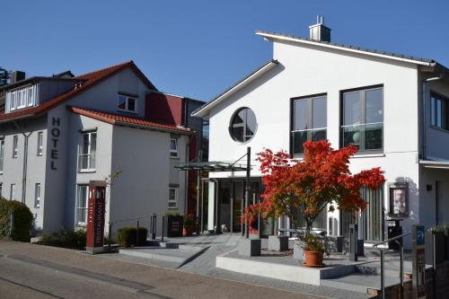 a row of houses on a city street at Weinhaus Steppe Hotel 3***Superior und Weinstube in Waldbronn
