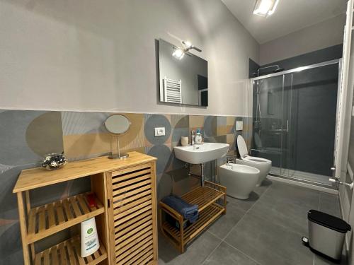 a bathroom with a sink and a toilet and a shower at Bcube - santa Bona Bed & Breakfast in Pisa
