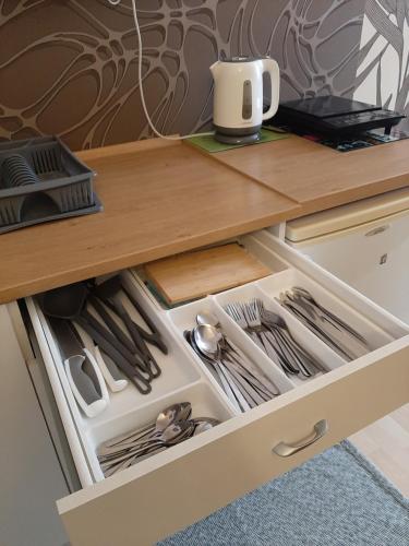 an open drawer in a kitchen counter with a drawer at Noclegi Viktor in Kalwaria Zebrzydowska