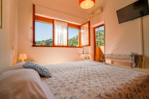 Postel nebo postele na pokoji v ubytování Hotel Da Ruggero - 100m dal Porto