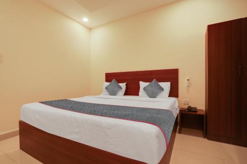 a bedroom with a large bed in a room at Gokul Pride in Hyderabad