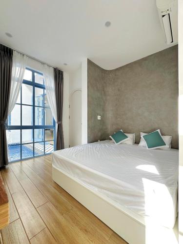 a bedroom with a large bed and a large window at Serena Villa, Da Nang, Viet Nam, 3 bedrooms - Vietnam in Danang