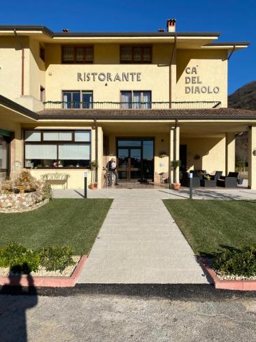 a building with a walkway in front of it at Ca' Del Diaolo in Badia Calavena