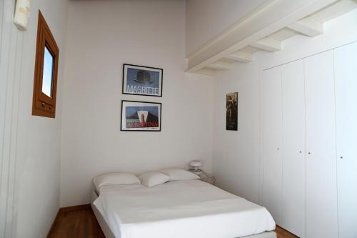 Ένα ή περισσότερα κρεβάτια σε δωμάτιο στο BellaIseo Luxury rooftop