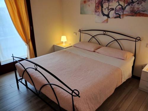 Postel nebo postele na pokoji v ubytování Appartamento Le Rose