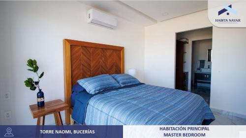 Una cama o camas en una habitación de Hermoso Departamento Vista Al Mar
