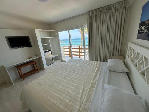 เตียงในห้องที่ Bungalows Playa Bonita