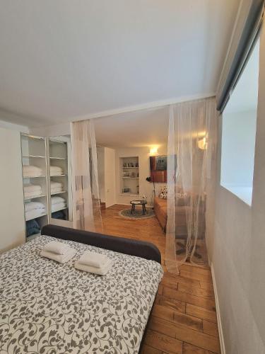 a bedroom with a bed with two towels on it at Max's downtown oasis in Zadar