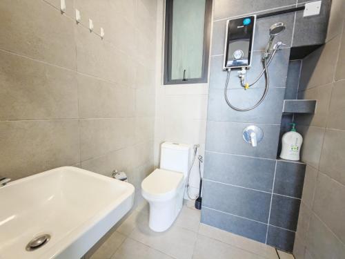 a bathroom with a toilet and a shower and a sink at Urban Suites Georgetown New Condo City View 158 in Jelutong