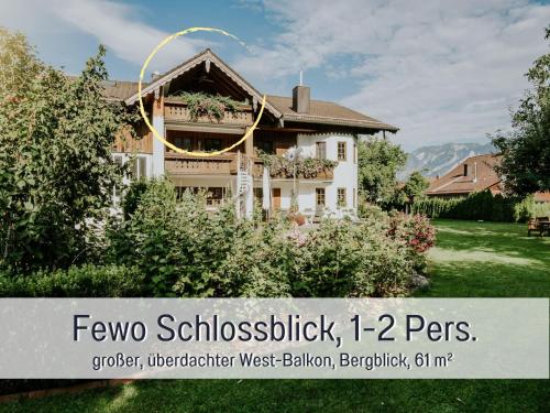 a house with a sign in front of it at Ferienhaus Bauer in Piding in Piding