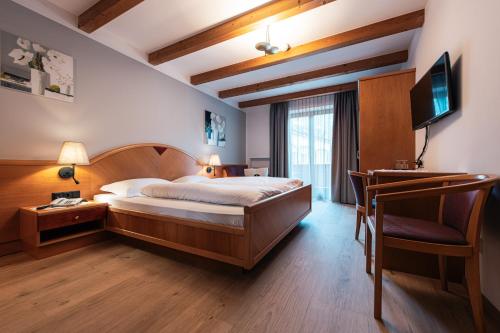 Postel nebo postele na pokoji v ubytování Hotel Goldene Rose