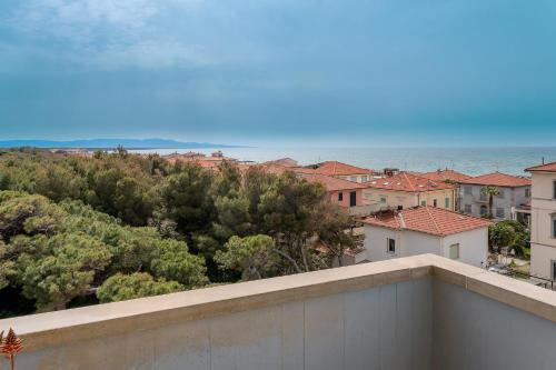 a view of the ocean from the balcony of a building at Hotel Tornese - Rooftop Sea View in Marina di Cecina