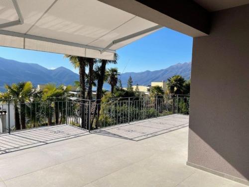 a patio with a fence and mountains in the background at Casa Bijou in Monti della Trinità