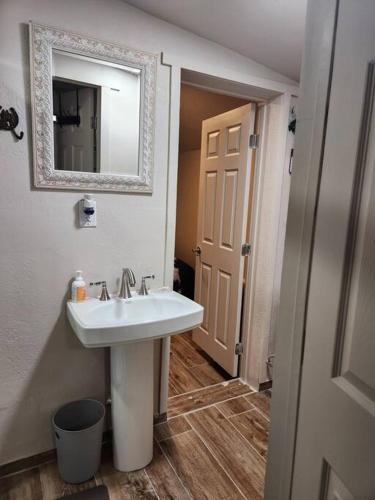 a bathroom with a sink and a mirror at Western Tinyhouse, Ready For Summer Fun! in Apache Junction