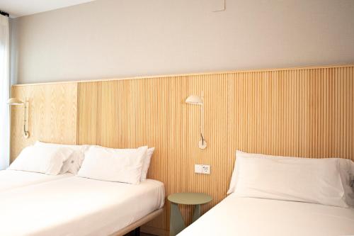 Posteľ alebo postele v izbe v ubytovaní Hotel Dos Rios Origen