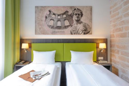 Cama o camas de una habitación en Ibis Styles Trier