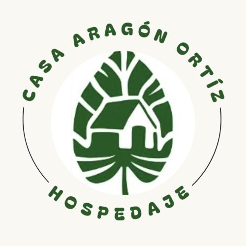 にあるCasa Aragón Ortiz 2の緑学院緑色のロゴ
