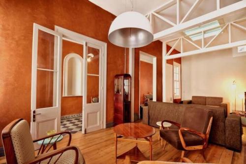 a living room with a couch and a table and chairs at Private Central 2BR/2BA House w Patio&Terrace in Konak