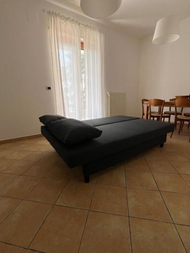 a bed in a room with a table and chairs at Villa Maria Palese in Bari