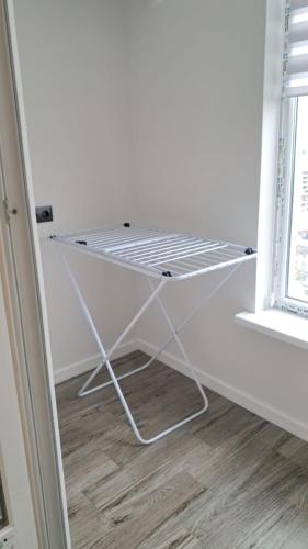 a white shelf in a room with a window at AIRPORT-TAXI-PARKING-Card in Chişinău