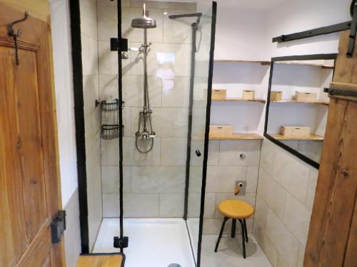 a shower with a glass door in a bathroom at Ferienwohnung Sommerberg, Lenzkirch, 2 Schlafzimmer in Lenzkirch