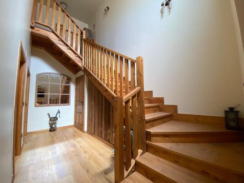 a staircase in a house with a dog in the middle at ALMA DEZERTO BARDENAS , 5 estrellas in Arguedas