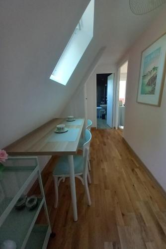 a dining room with a table and chairs at La Chambre d'Agapè in Fouesnant