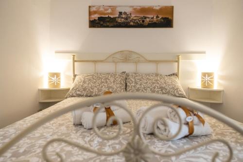 Cama o camas de una habitación en CASETTA CLOE house of charm and romance