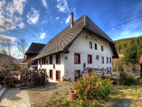 a large white house with a black roof at Schwarzwaldhaus Krebs - Peter Lustig, Lenzkirch, Feldberg in Lenzkirch