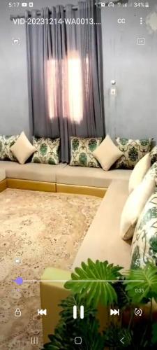 a living room with a couch and a window at Apartment Ami in Nouakchott