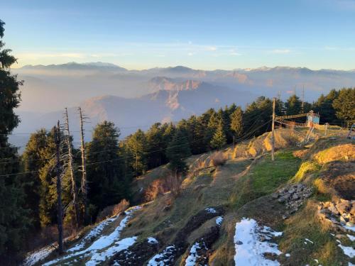 a view from the top of a mountain with snow at SmartValley View Dalhousie-Nature`s Heaven in Dalhousie