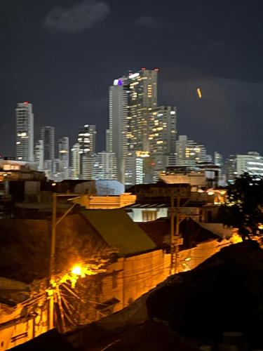 a view of a city skyline at night at La Viduka Hostel in Cartagena de Indias