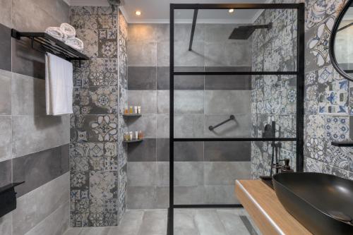 a bathroom with a shower and a sink at Grand Master Suite in Rhodes Town