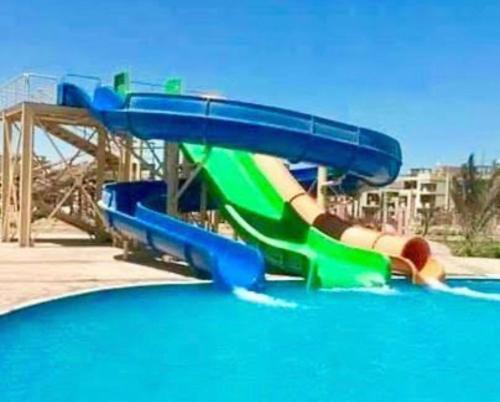 a water slide in a swimming pool at Marseilia blue bay asia in Ain Sokhna