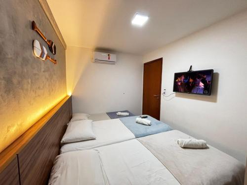 Postel nebo postele na pokoji v ubytování Apartamentos 250m da Orla -Edifício Nugali- Castelo B Temporada