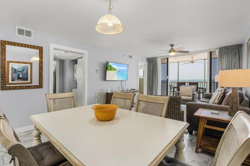 a living room with a table and chairs at Fantastic Gulf Front Condo on the North End of the Island - Beach Villas # 504 condo in Fort Myers Beach