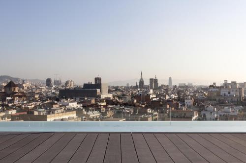 a view of a city from the roof of a building at Andante Hotel in Barcelona