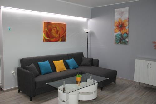 a living room with a couch and a table at Apartment Patra Greece in Patra