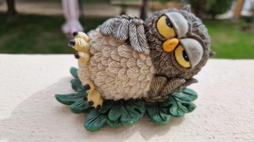 a figurine of an owl sitting on a table at Bibi a Mare in Finale Ligure