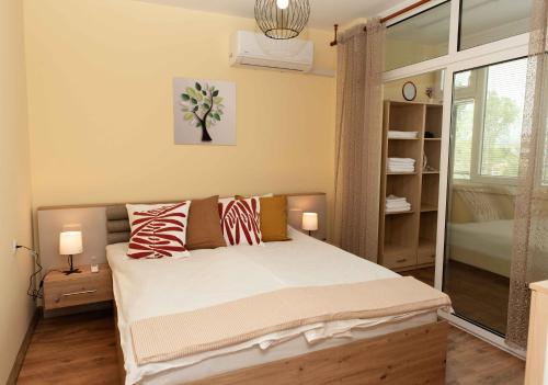 En eller flere senge i et værelse på Momento Apartment