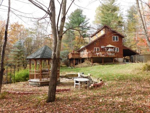 a large wooden house with a gazebo at Where Memories Are Made in West Kill